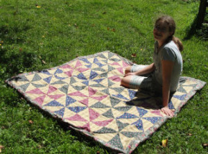 Kelli showing her beautiful pinwheel quilt. 