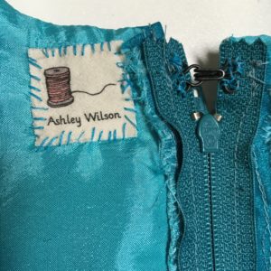 young fashion designer clothing tag