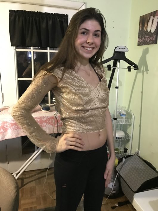 sarah showing her golden prom dress she is making