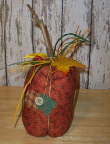 A completed rustic country pumpkin craft that is easy to sew and handmade