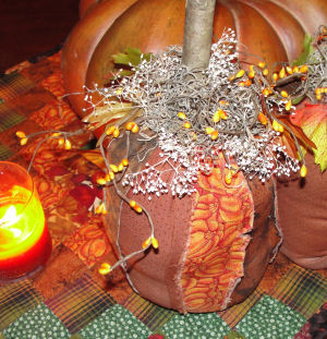 A handmade and easy to sew fall pumpkin craft that highlights a primitive style