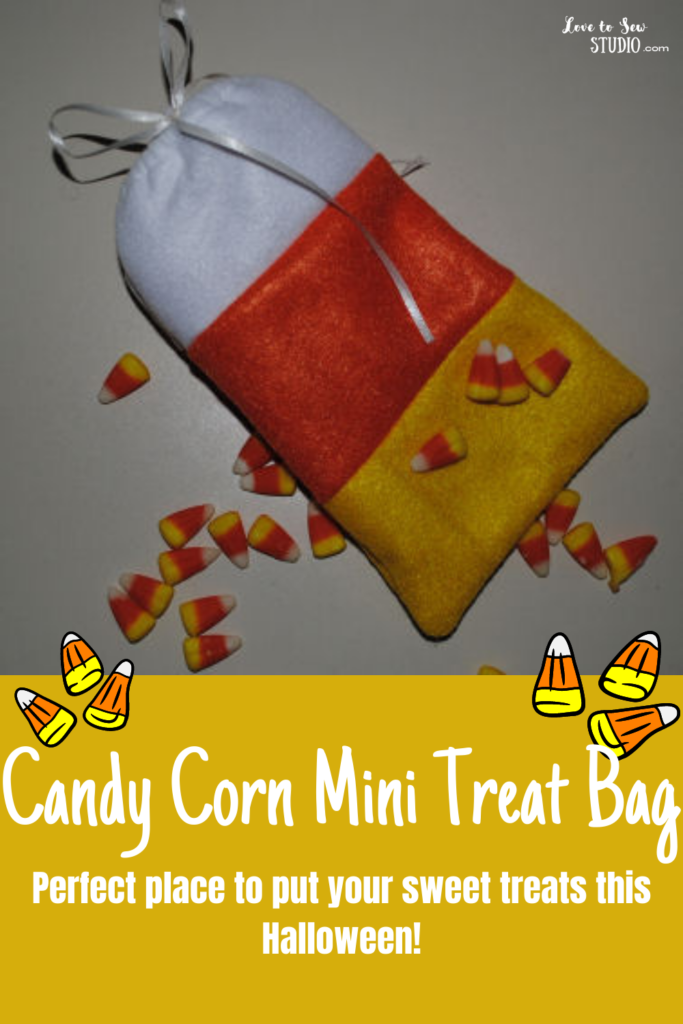 White, orange, and yellow fabric put together to make a small treat bag
