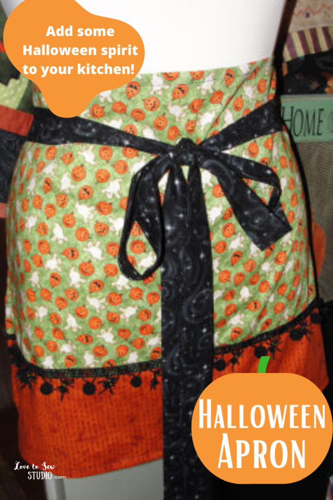 made from jack-o-lantern fabric is a apron for halloween