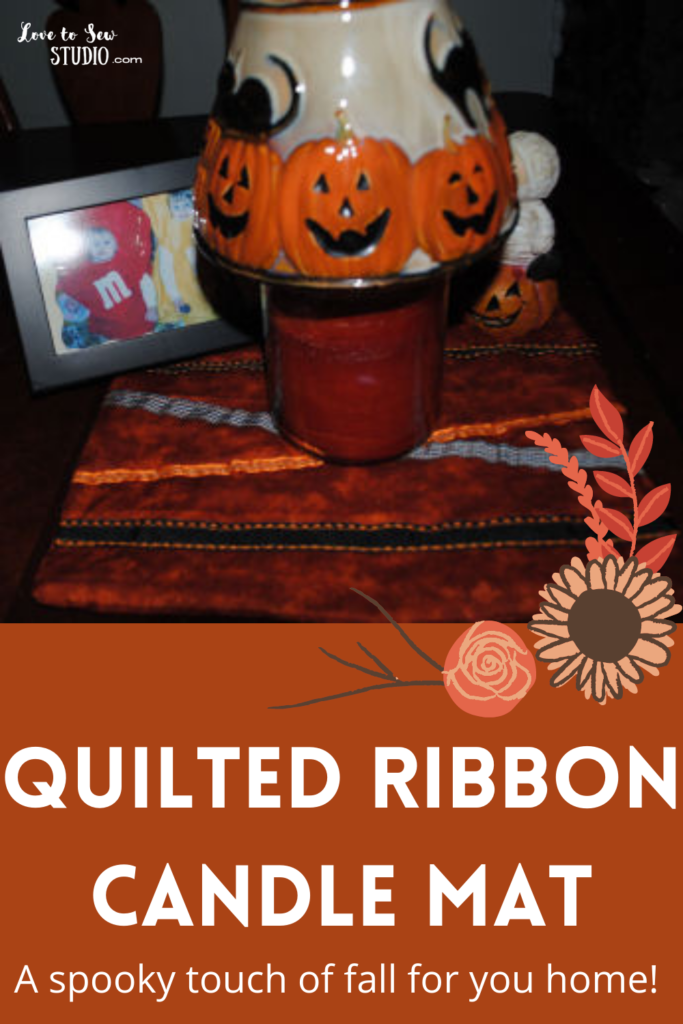 Fall colored ribbon and fabric quilted together to make a mat for candles