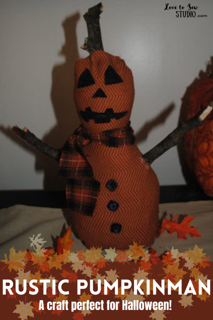 A fall pumpkin snowman made from fall fabric