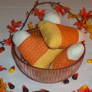 The finished product of candy corn crafts that are easy to sew in a free Halloween tutorial the produces handmade crafts
