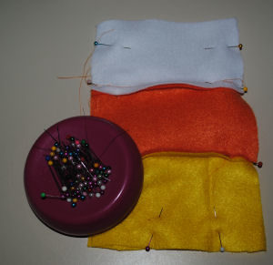 An easy to sew drawstring candy corn bag for Halloween that is handmade
