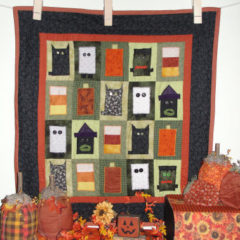 An easy to sew Halloween quilt that is handmade and has a free tutorial