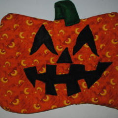 An easy to sew quilted pumpkin Halloween that is handmade