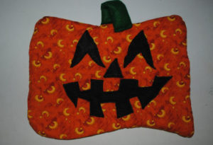 An easy to sew quilted pumpkin Halloween that is handmade