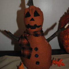 A Halloween craft that is easy to sew and handmade, featuring a perfect pumpkinman