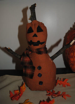 A Halloween craft that is easy to sew and handmade, featuring a perfect pumpkinman