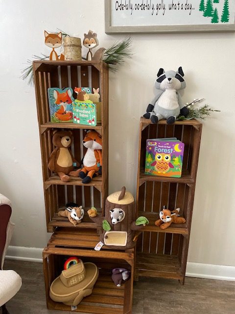 wooden crates with woodland animals in them