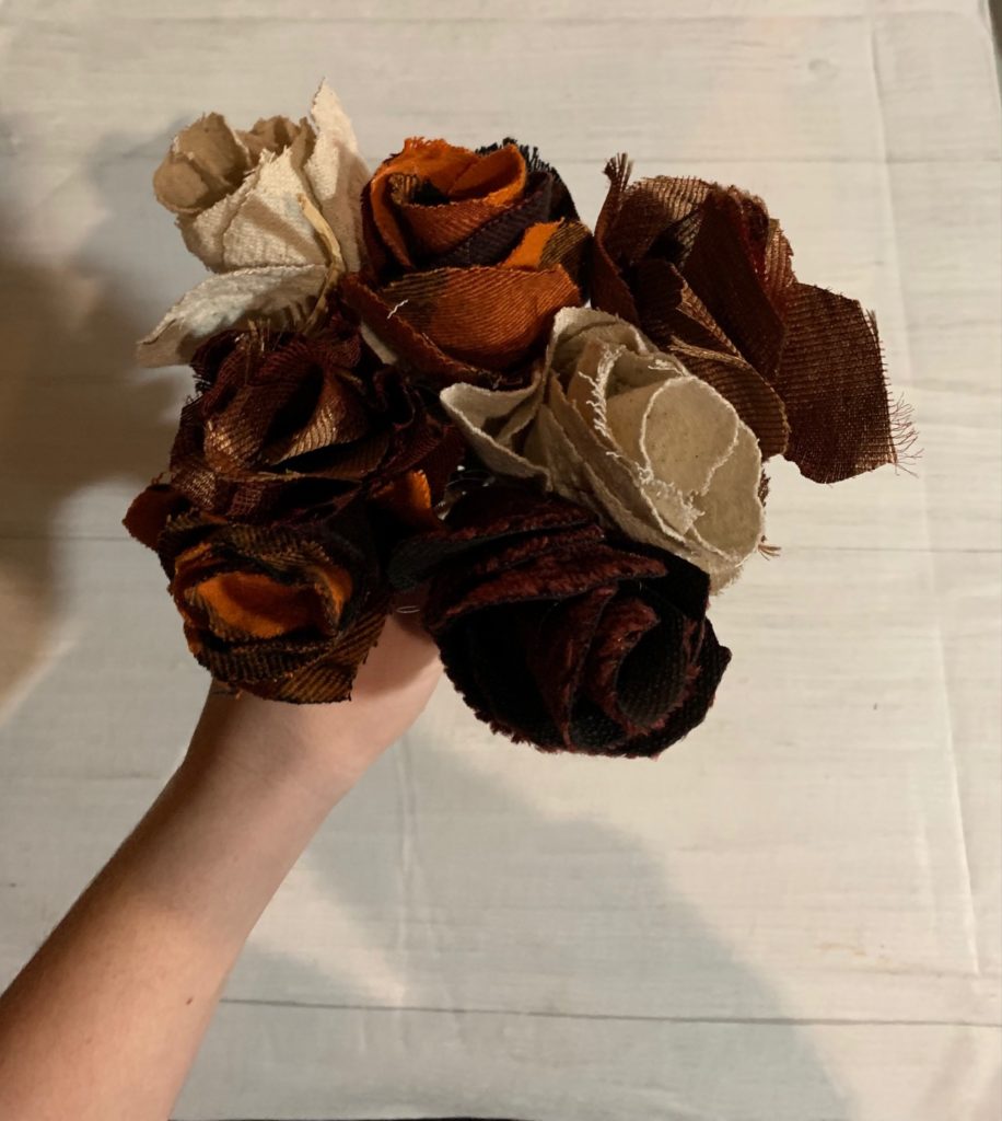 Fall fabrics made to look like roses with stick stems