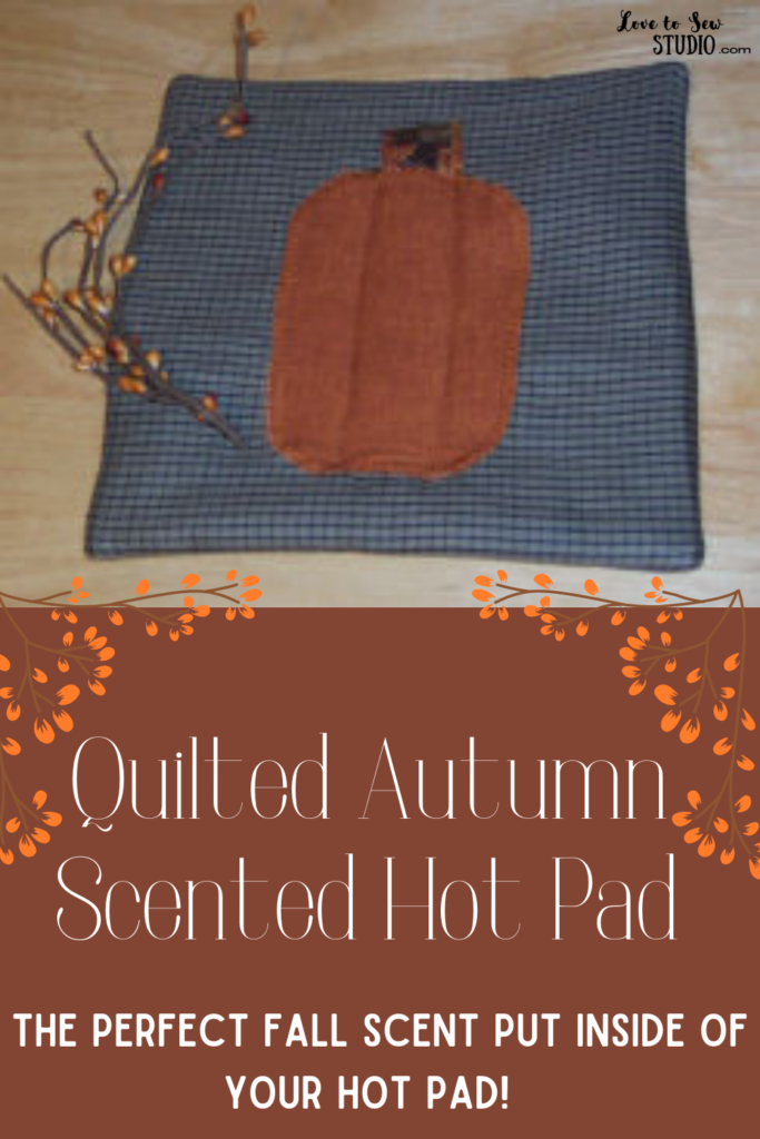 made from fabric a hot pad with a pumpkin on it and a fall scent