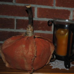 burlap fabric painted orange and sewed together to look like a pumpkin
