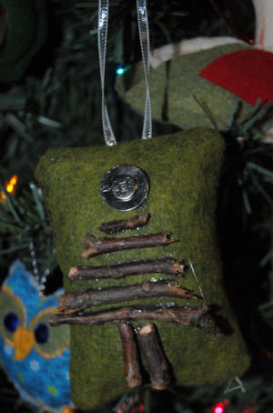 use felt and sticks to make a green and brown christmas tree ornament