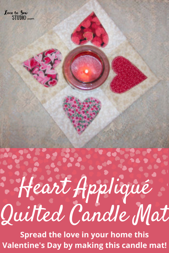 Fabric quilted with hearts for a candle mat