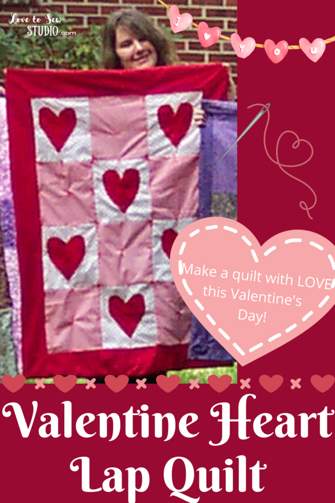 a quilt with red, pink, and white fabric and hearts