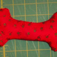 fabric dog bone made from red fabric