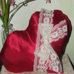 Using red satin to make a bright red heart pillow and some lace detail