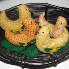 yellow handmade chicks put into a basket for easter