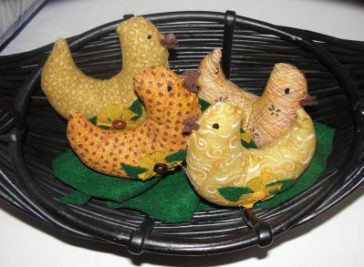 yellow handmade chicks put into a basket for easter