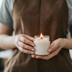someone holding a handmade candle
