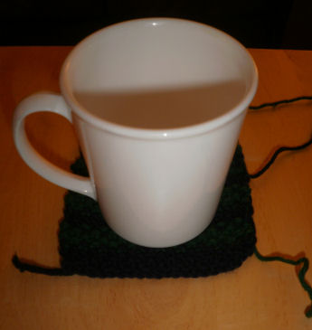 a knitted striped coaster