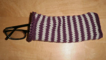 purple and white striped knitted glasses case