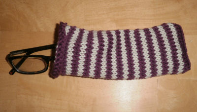 purple and white striped knitted glasses case