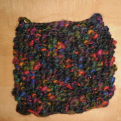 colorful fabrics knitted together to make a hot pad