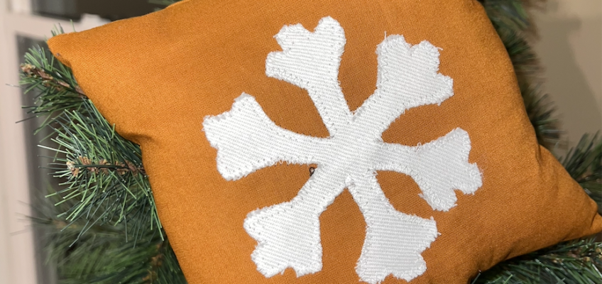 snowflake appliqué made into a pillow